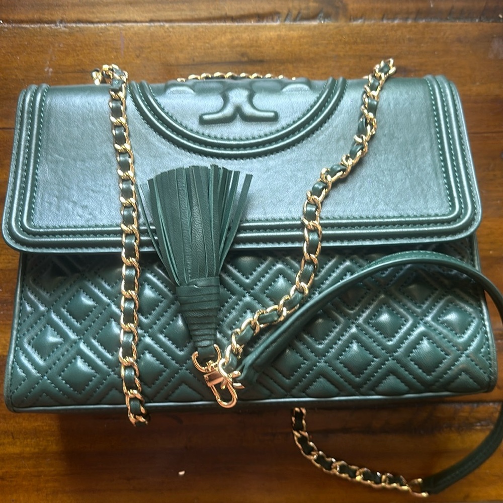 Green Tory Burch bag with gold tassel strap